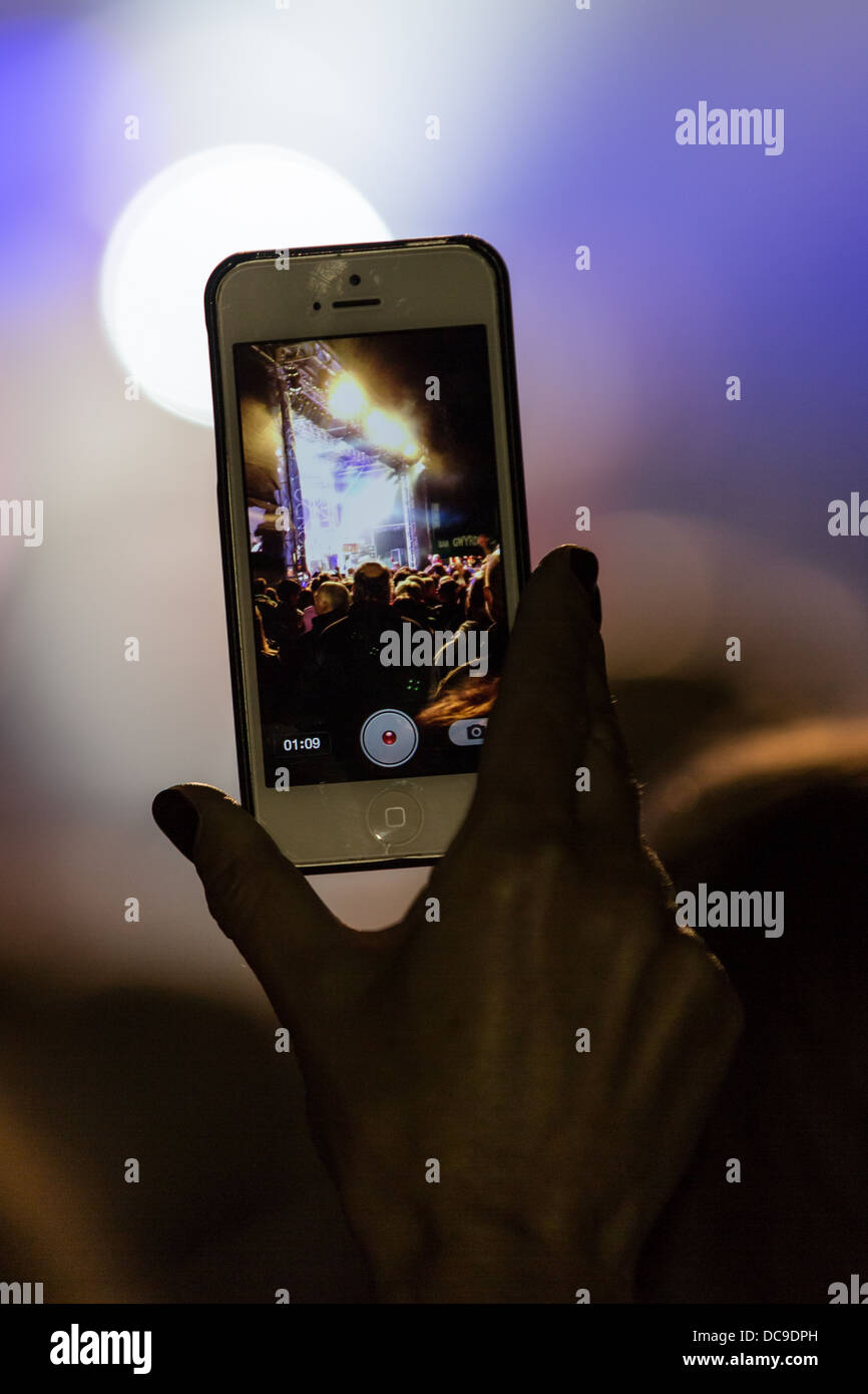 Filming rock concert on mobile phone. Edward H Dafis farewell concert at the National Eisteddfod, 2013, Denbigh Stock Photo
