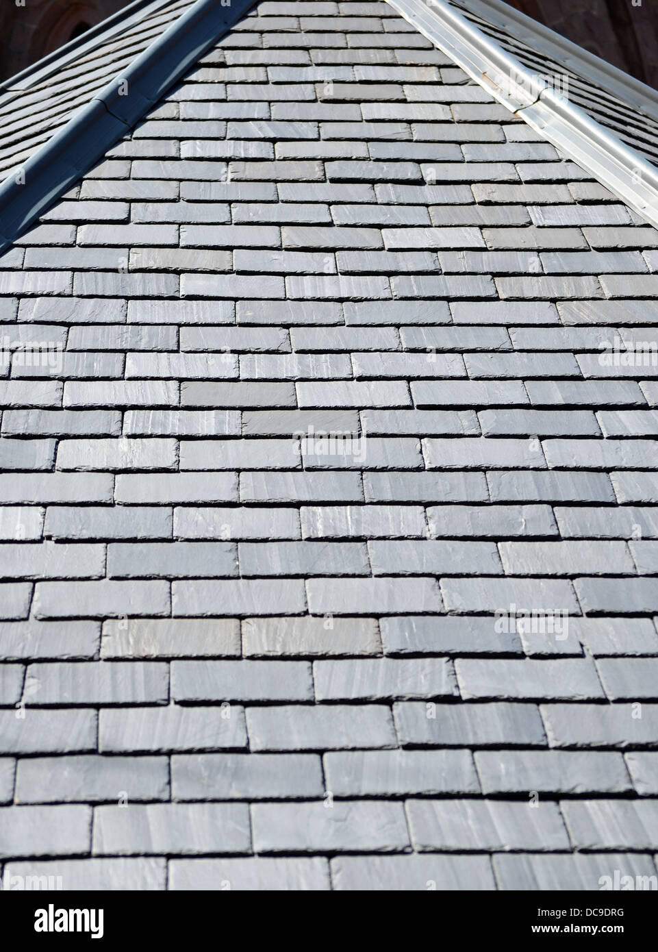 A rooftop covered with gray slate shingles Stock Photo