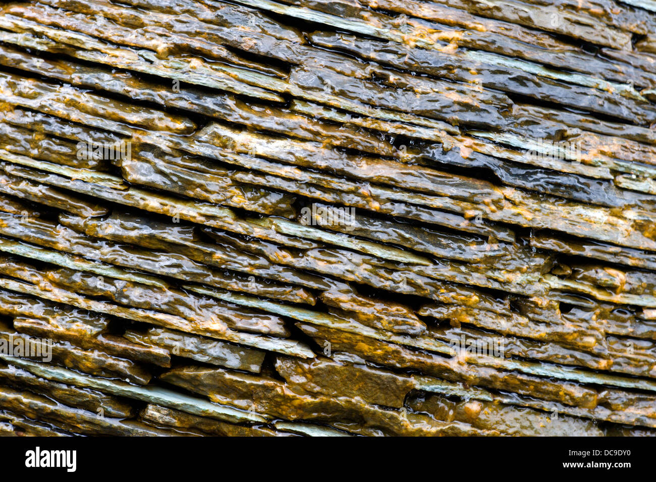 Unusual view of slate used as a water feature in the gardens of Cawdor Castle near Nairn Scotland Stock Photo