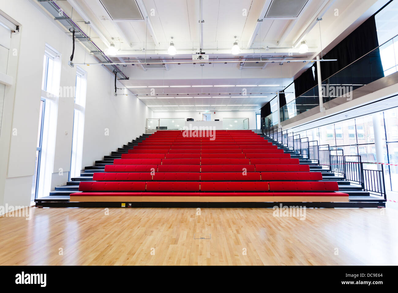 open retractable seating in school hall at Notting Hill Ealing High School Stock Photo Alamy