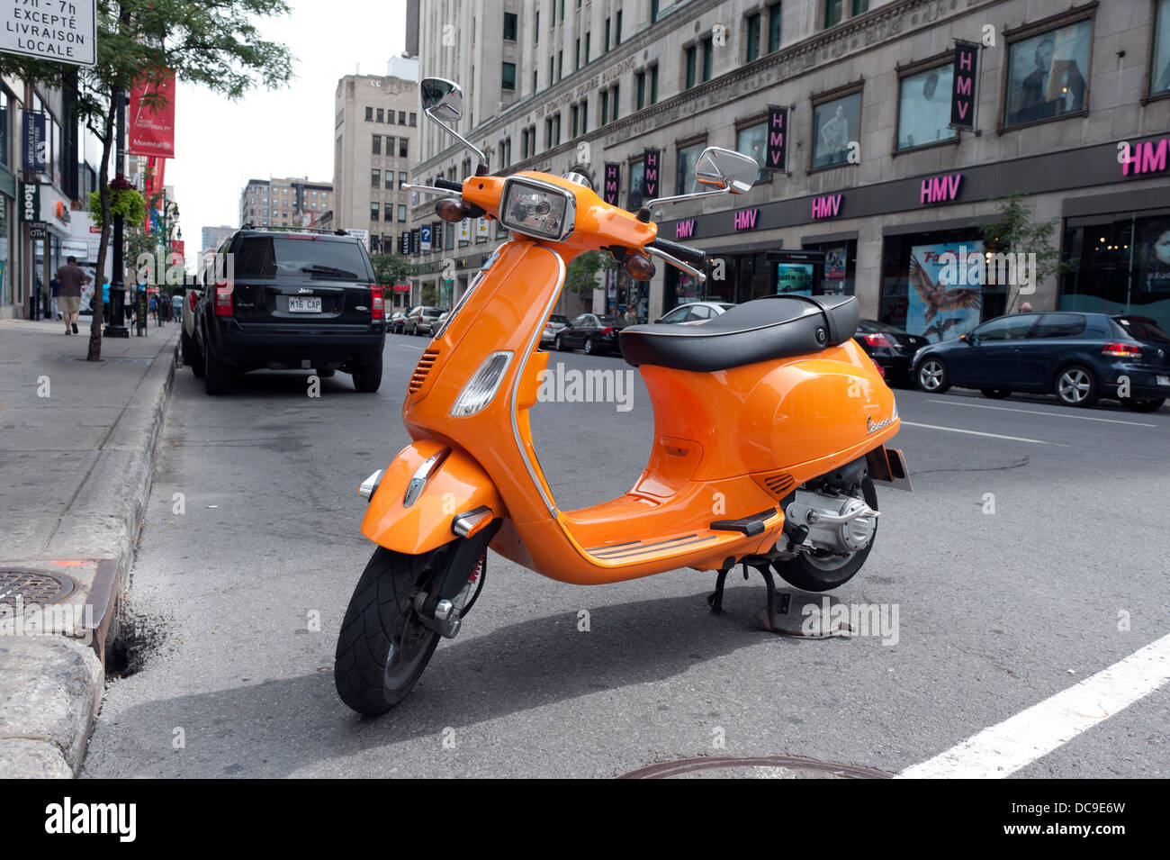 Orange scooter parked in downtown Montreal, province of Quebec, Canada  Stock Photo - Alamy