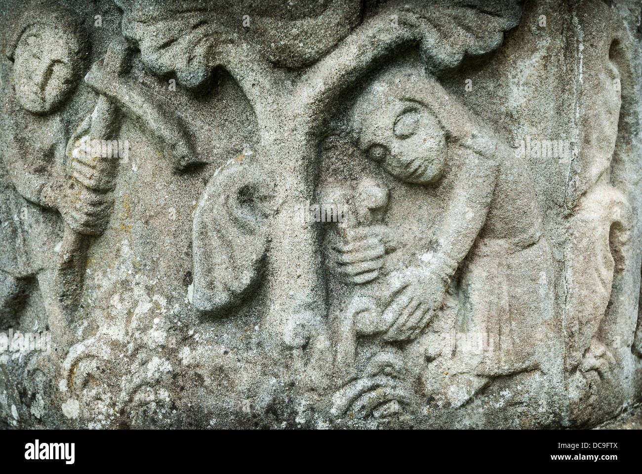 Medieval Stone Carving of man and woman working in a garden or farm. Stock Photo