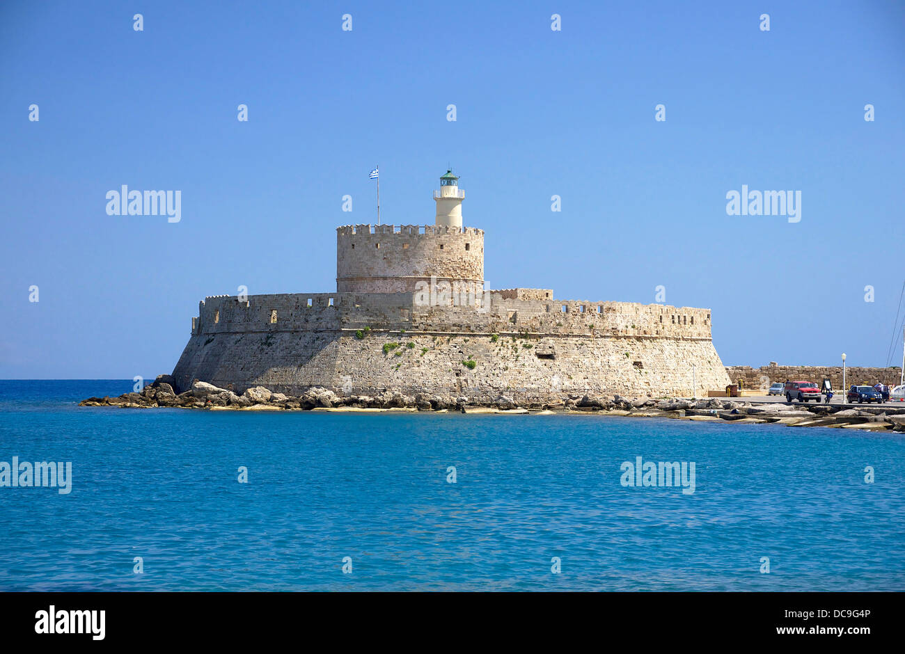 fort Saint Nicolas (and lighthouse), 14th century, entrance of the old harbour of Rhodes, Greece. Stock Photo
