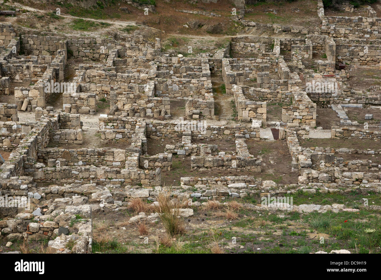 ruins of the ancient city of Kameiros, island of Rhodes, Greece. Main street visible horizontally. Stock Photo