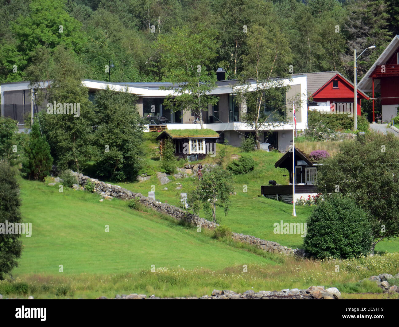 NORWAY  Modern home on the west coast with contrasting turf roof building in the garden. Photo Tony Gale Stock Photo