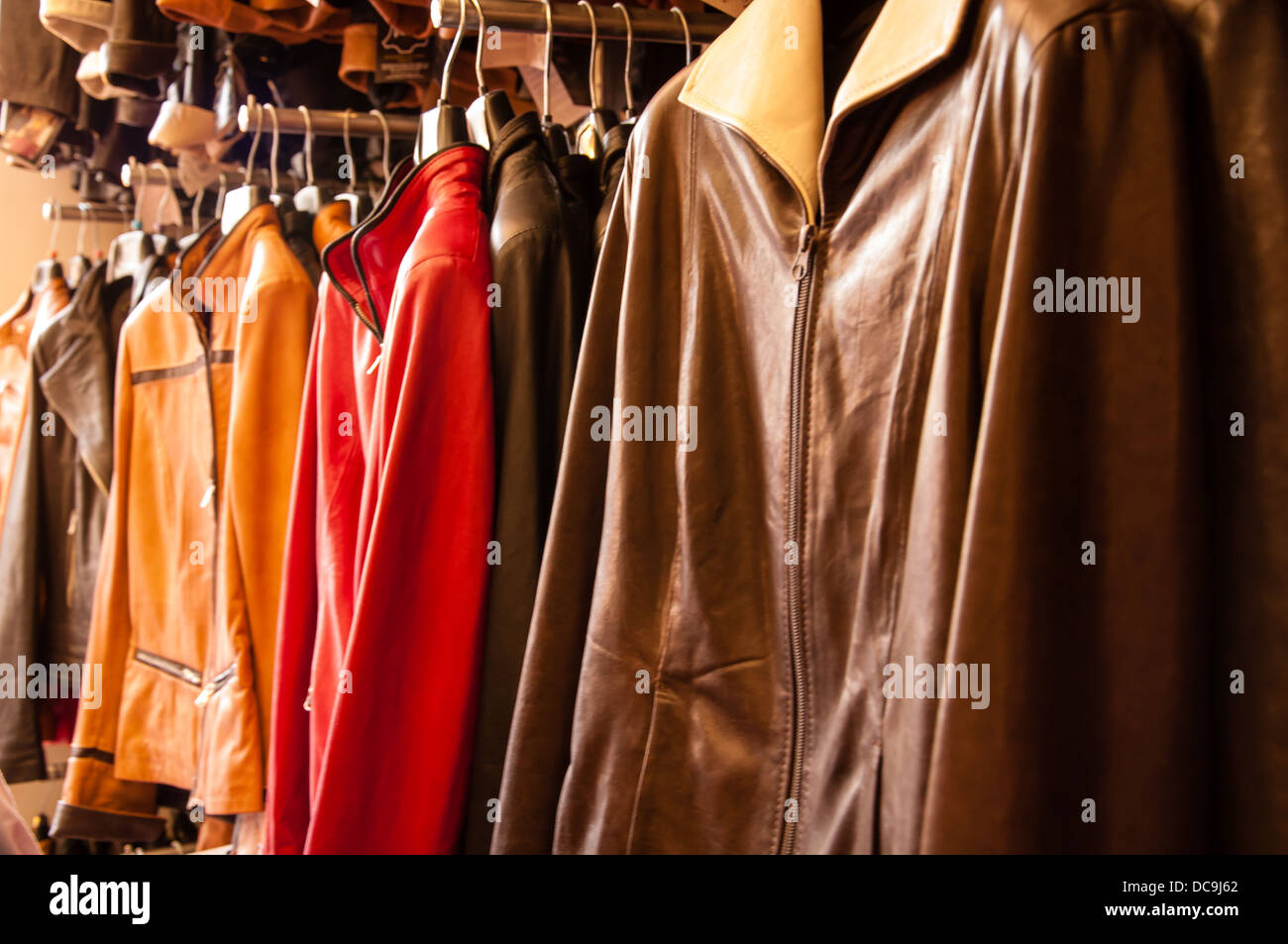 different colored leather jackets on display Stock Photo