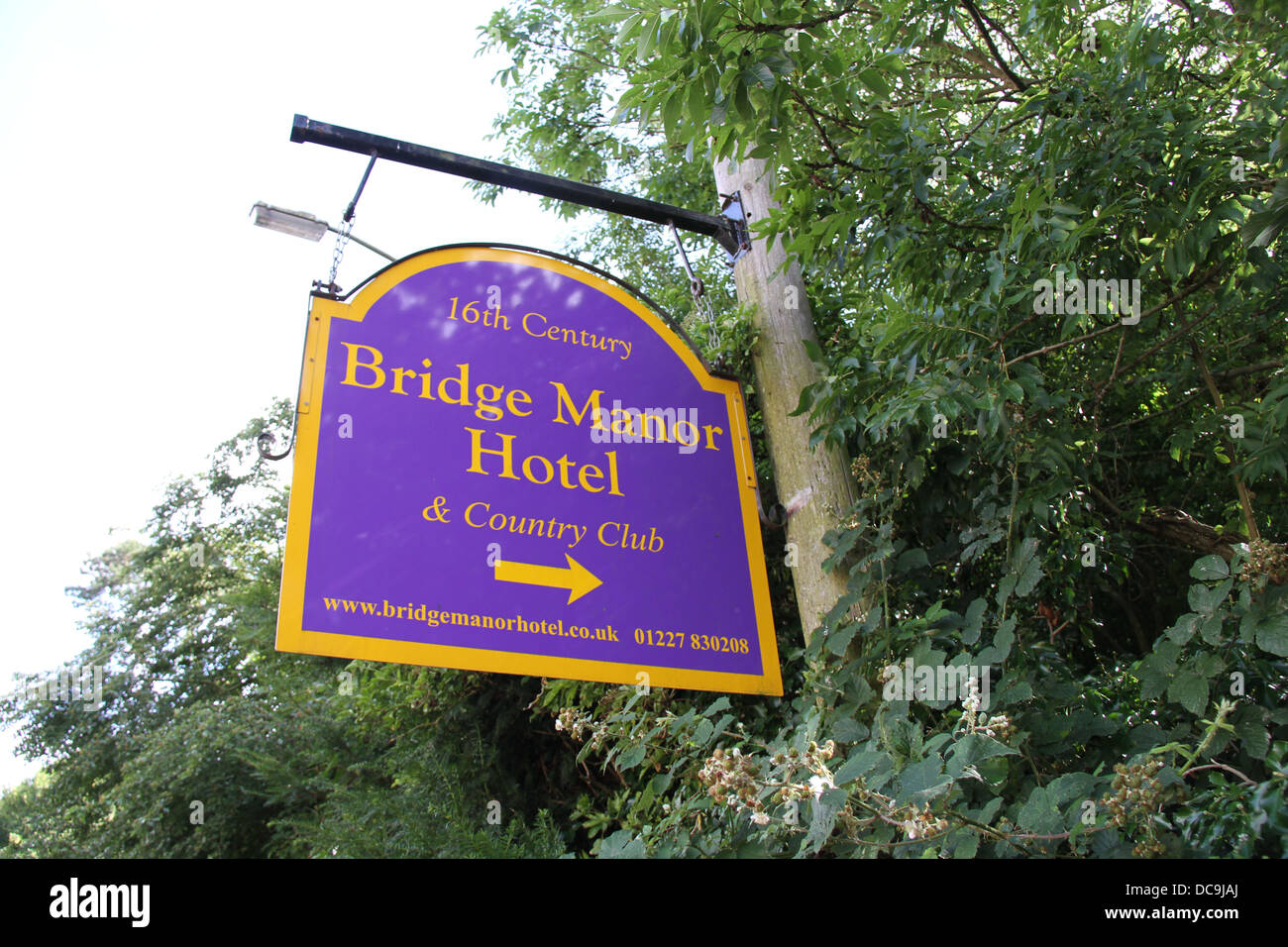 A sign in the village of Bridge giving directions to the 16th Century Bridge Manor Hotel