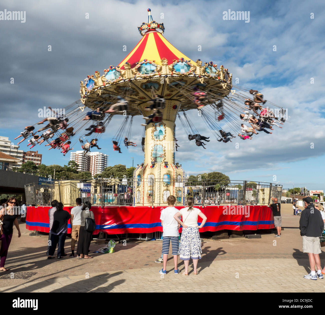 People enjoy the highflying swings at the Funfair at the coastal holiday resort Bournemouth