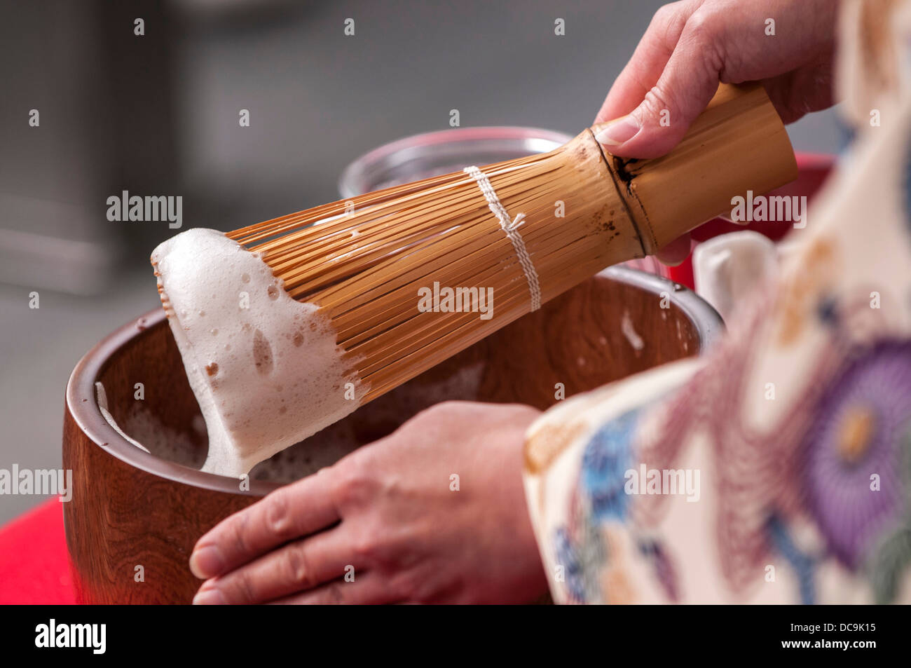 A woman performs the traditional Ryuku Buku Buku Cha Tea ceremony
