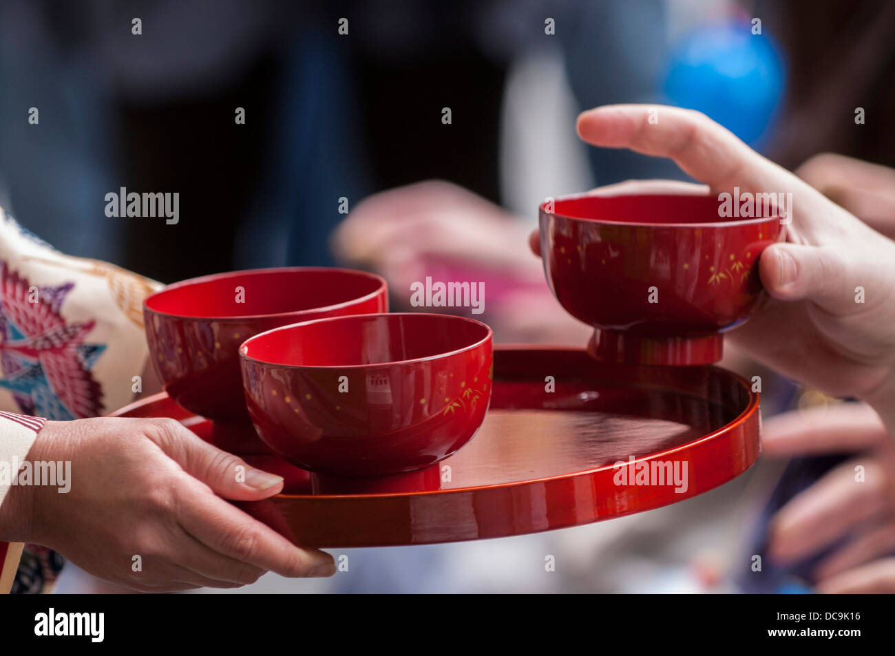 A woman performs the traditional Ryuku Buku Buku Cha Tea ceremony