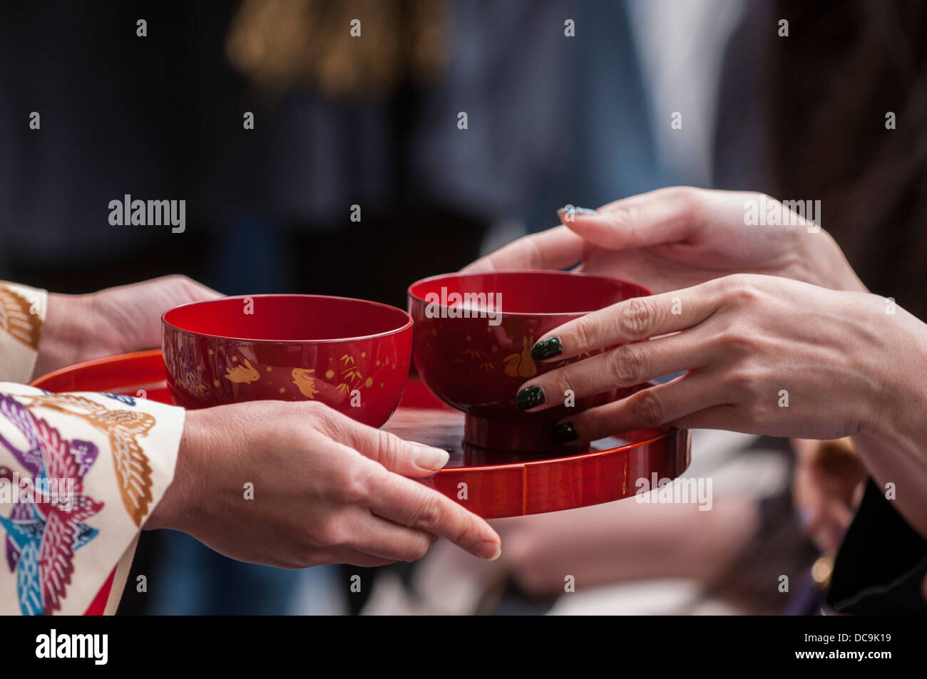 A woman performs the traditional Ryuku Buku Buku Cha Tea ceremony