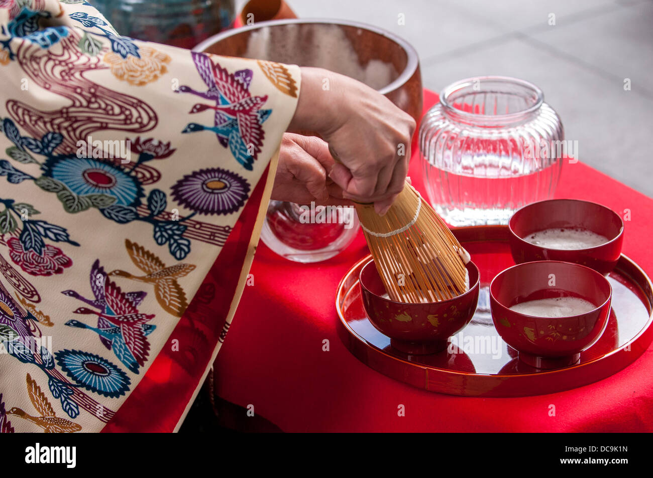 A woman performs the traditional Ryuku Buku Buku Cha Tea ceremony