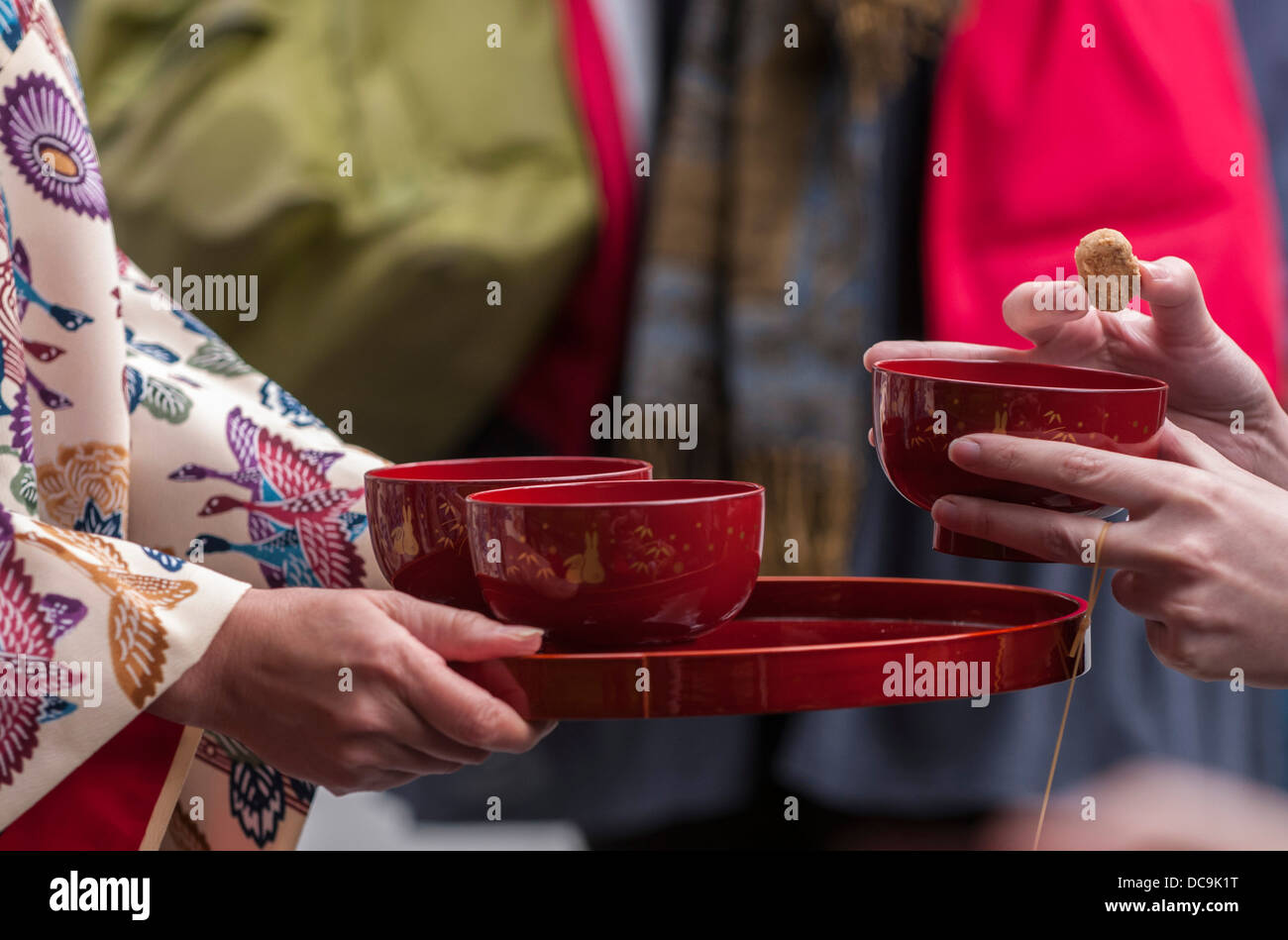 A woman performs the traditional Ryuku Buku Buku Cha Tea ceremony