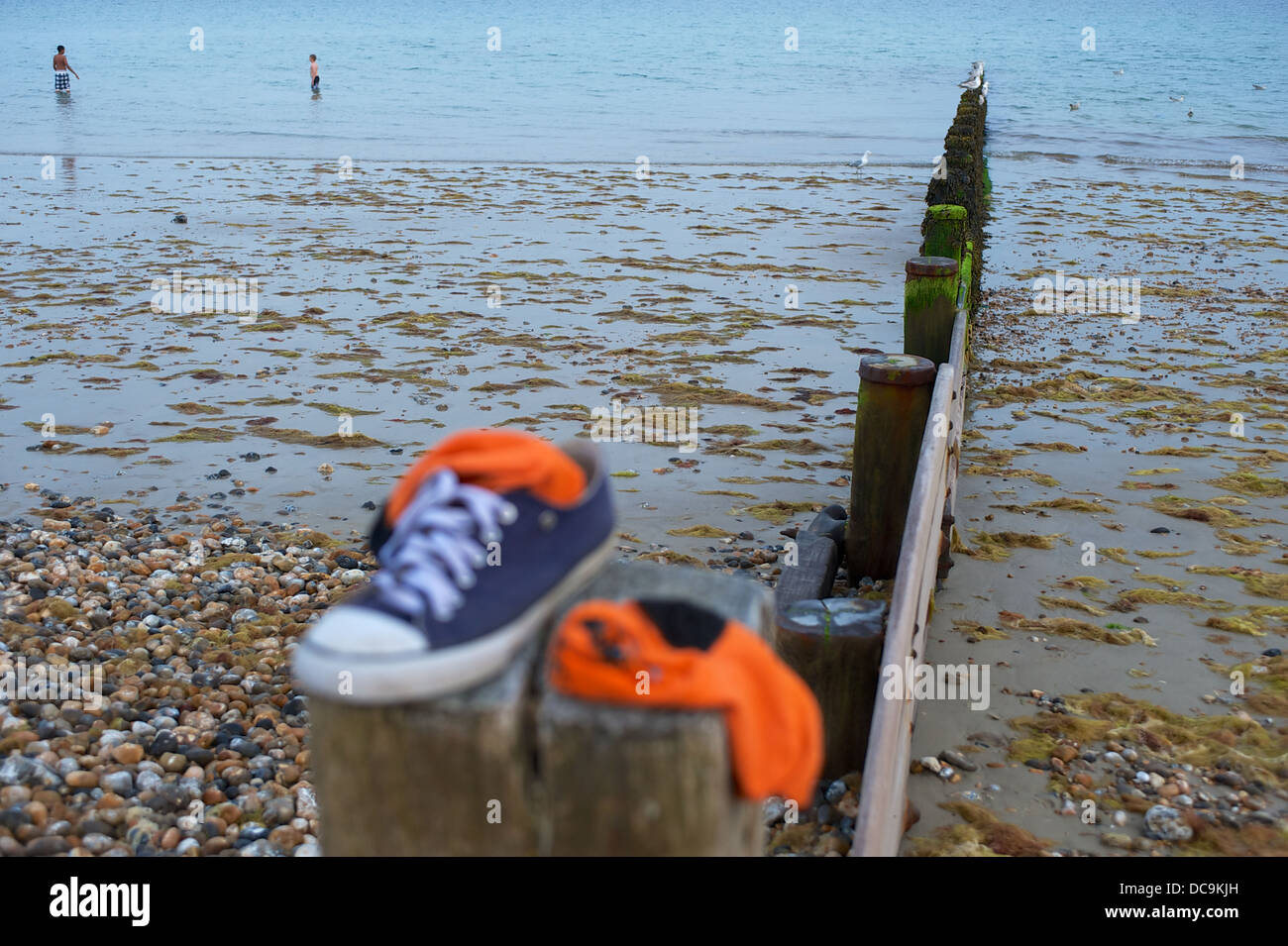 leaving trainers on the beach whilst paddling Stock Photo