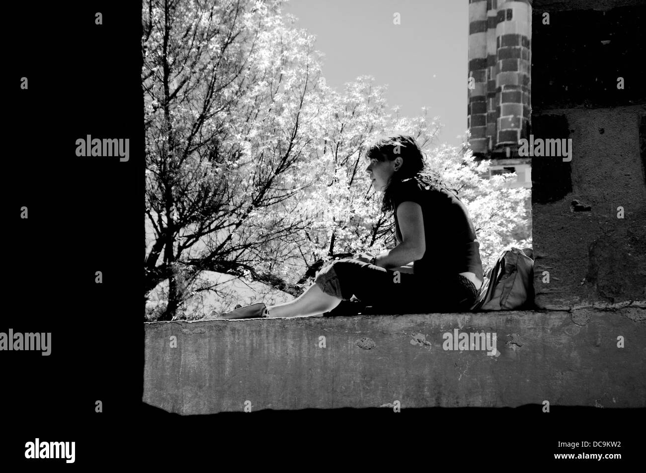 Hispanic girl reading a book Stock Photo - Alamy