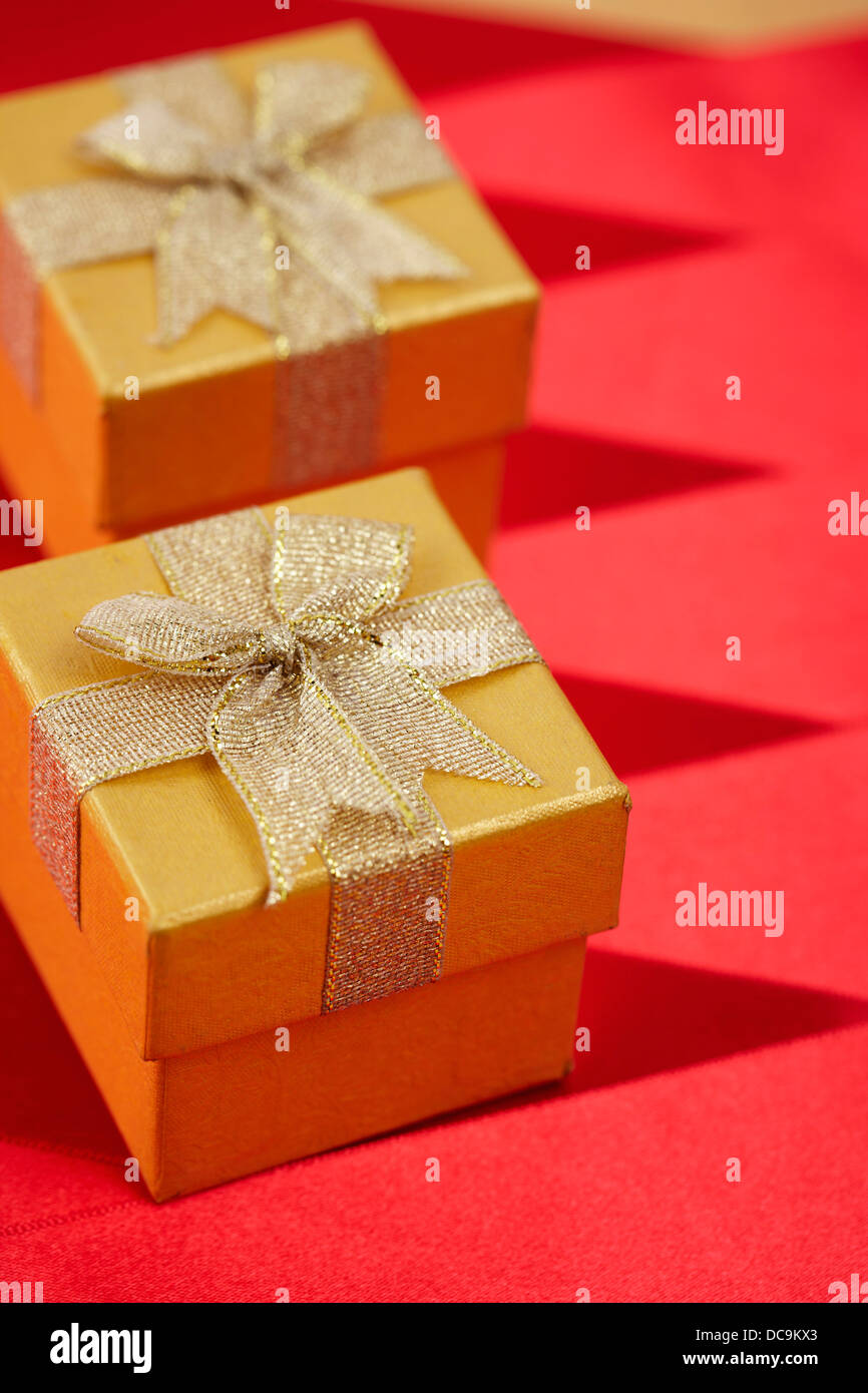 graceful orange gift boxes with golden ribbons Stock Photo Alamy