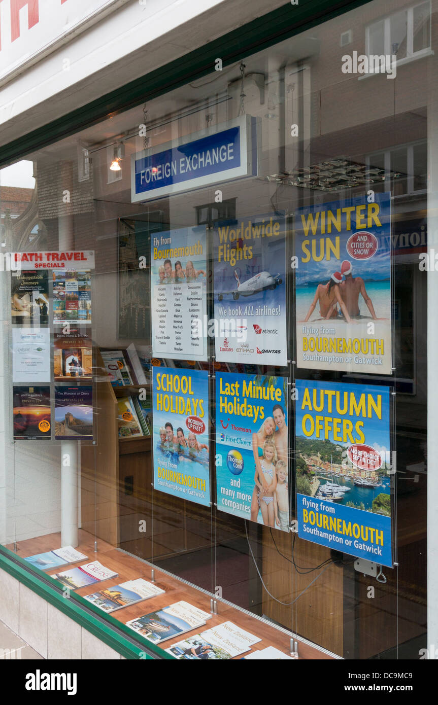 Posters in a vacation travel agents window display Stock Photo Alamy