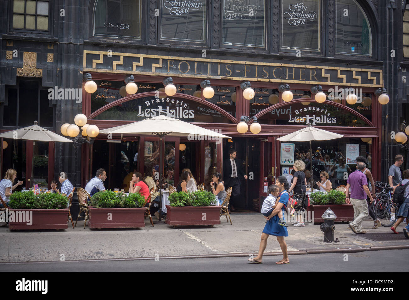Busy al fresco dining at a sidewalk cafe for the Brasserie Les Halles