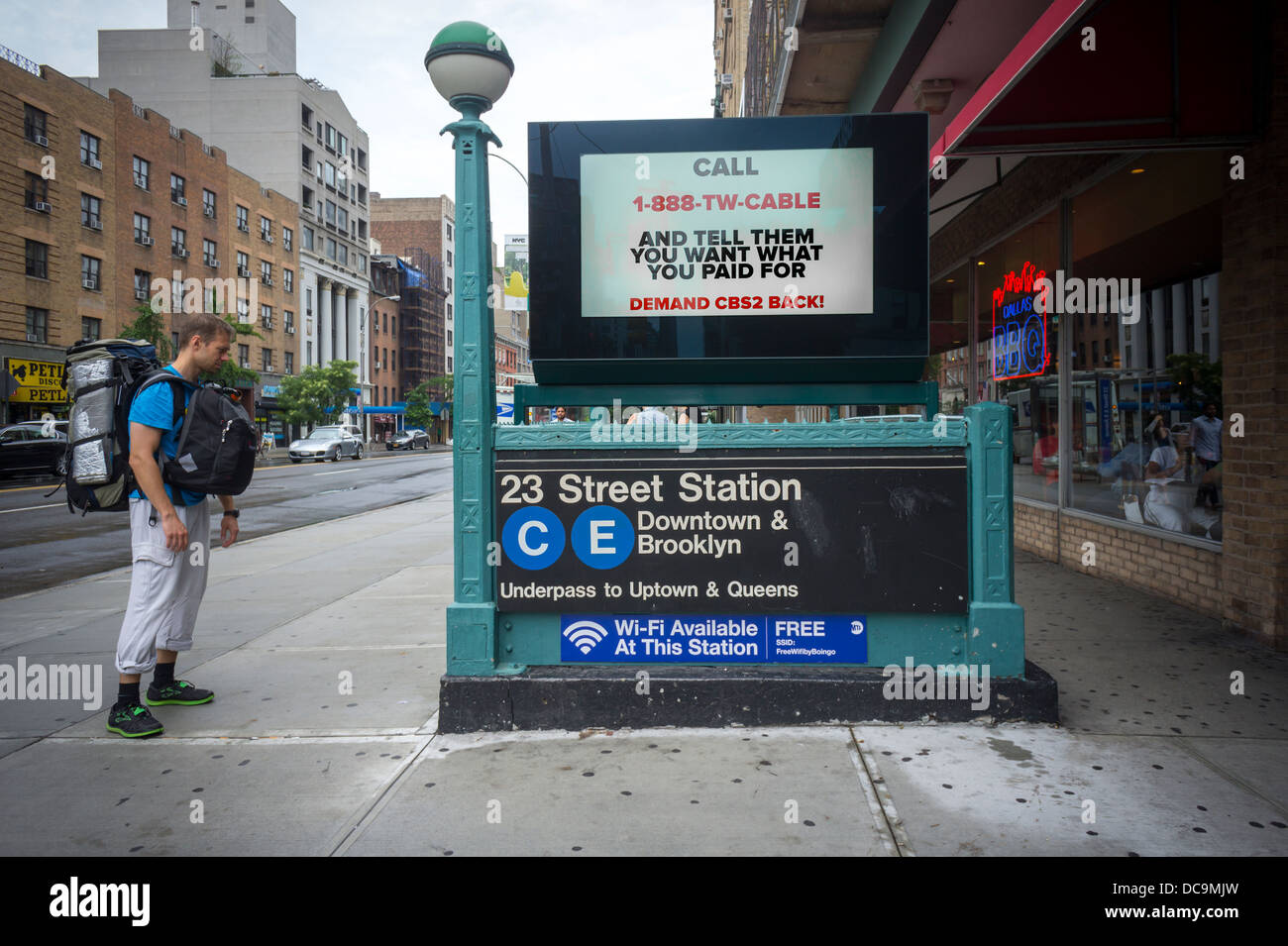 An electronic billboard on a subway entrance in New York urges