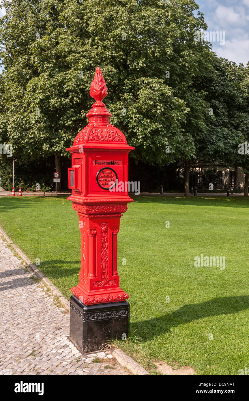Historic red firebox in front of the Bellevue Palace, Schloss Bellevue, residence of the President of Germany, Berlin Stock Photo