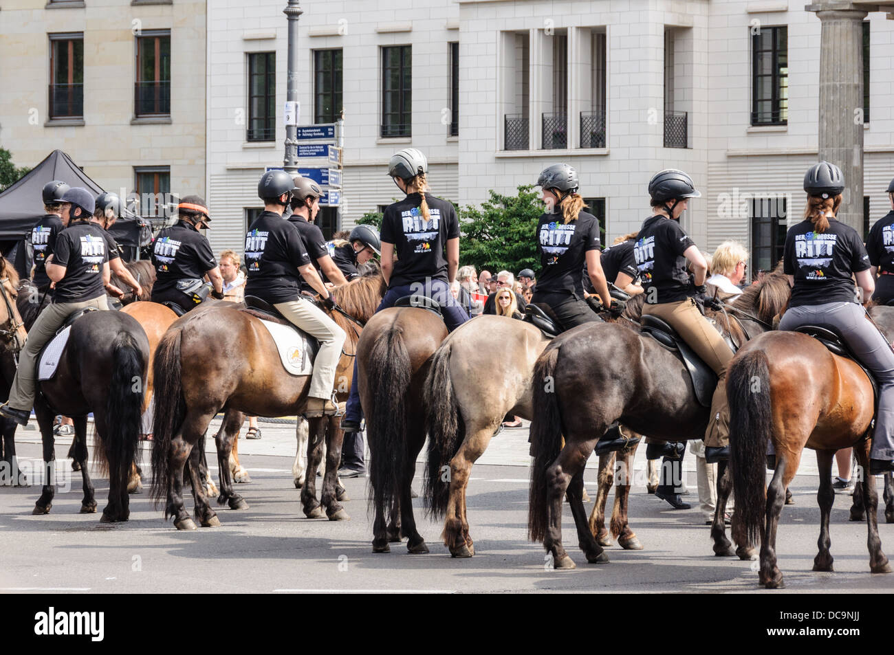 Riders wearing safety helmets, riding Icelandic horses 17th of June
