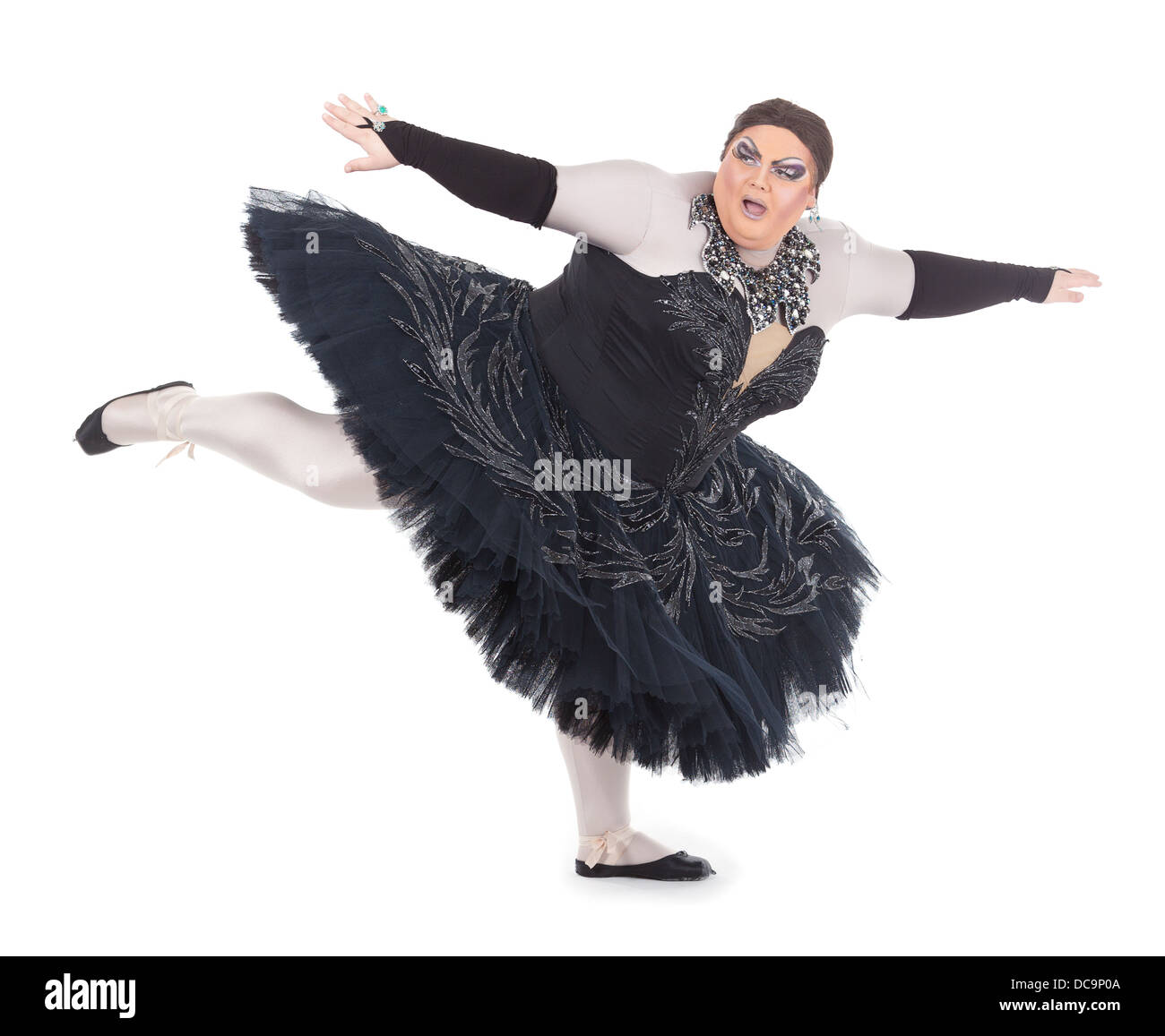 Overweight drag queen dancing in a tutu nimbly balancing on tiptoe with