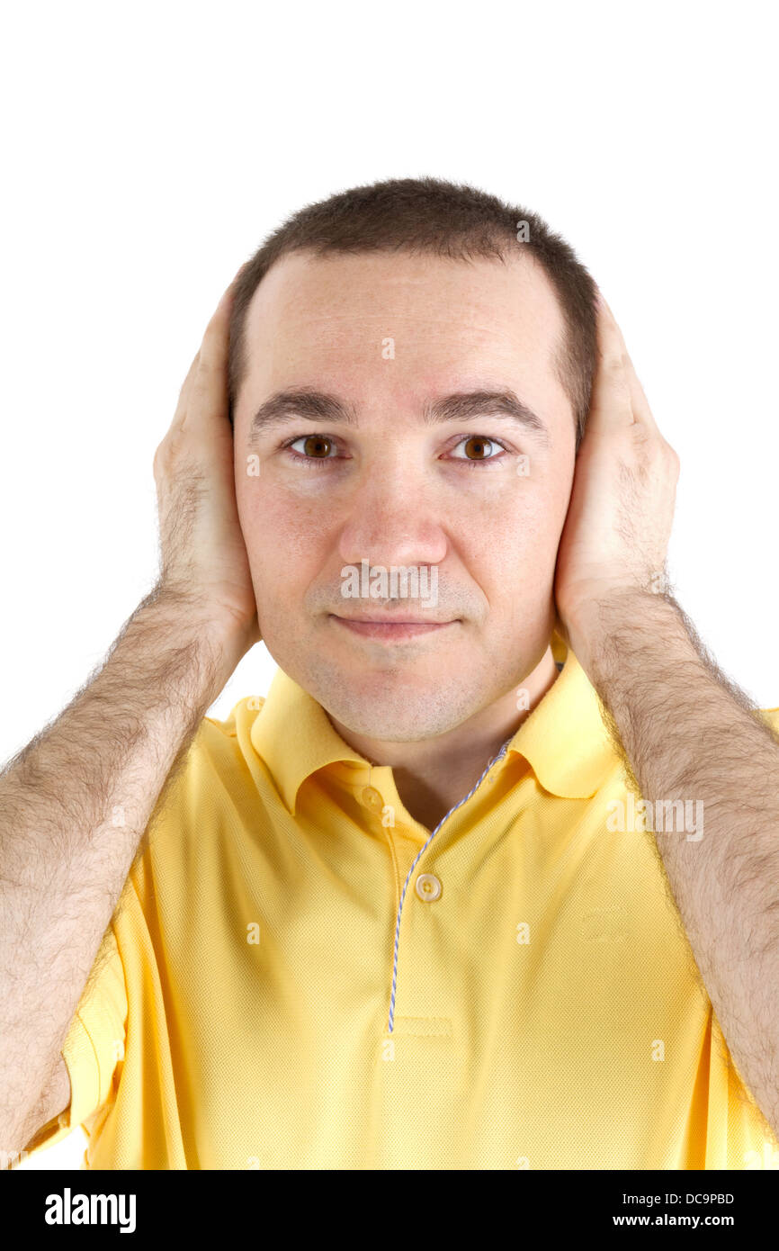 man covers his ears with his hands on a white background Stock Photo