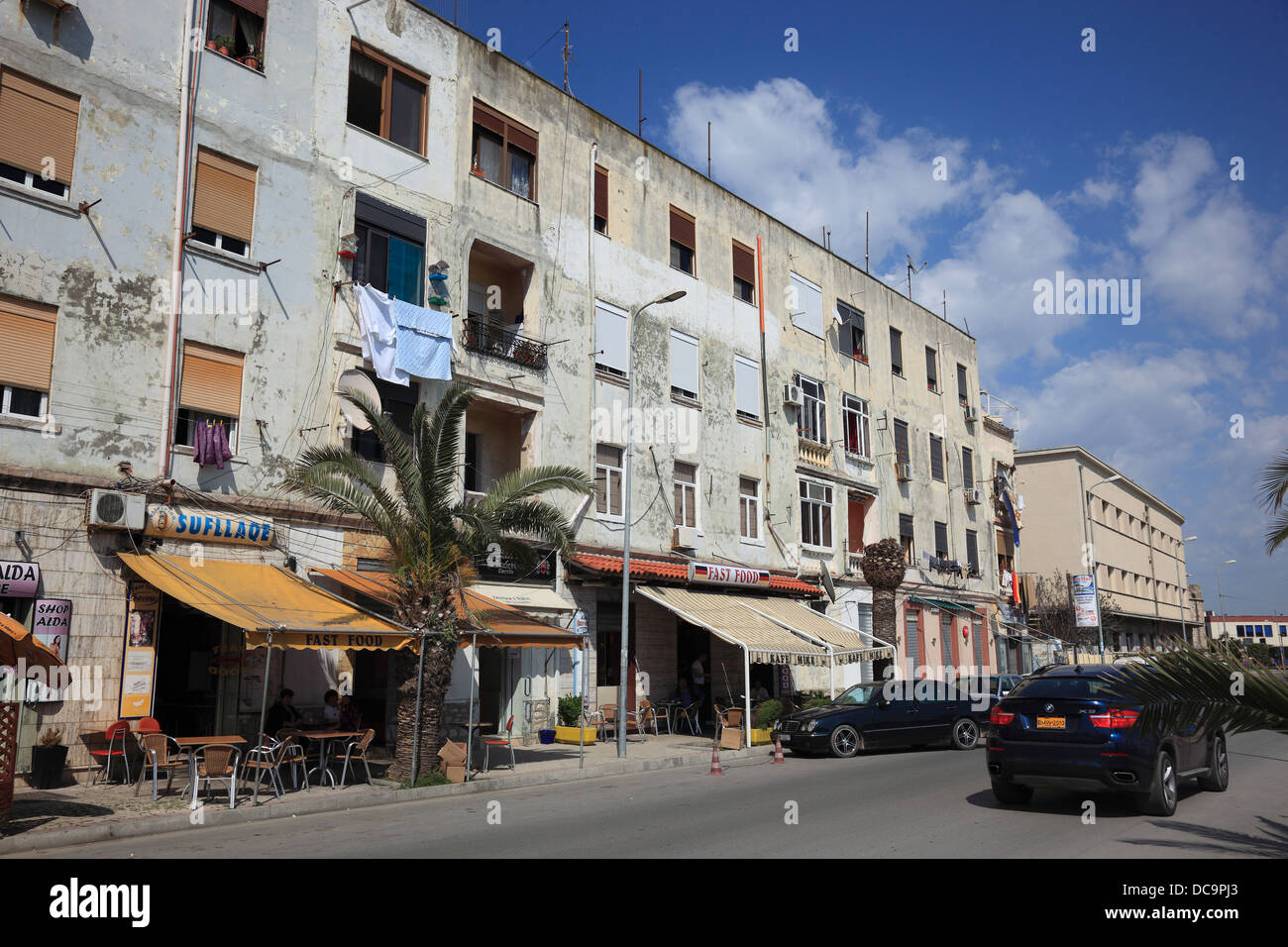 Durres, second largest city of Albania, street with shops and houses at