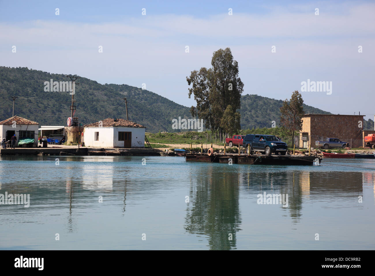 Small ferry crossing river Pavlles near Butrint, south of Albania Stock ...