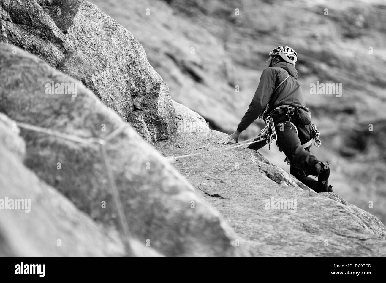 Low view on alpinist on the rock cliff. 'Mon coeur espagnol' route on Petit Jorasses face in French Alps. Haute-Savoie. France. Western Europe. Stock Photo