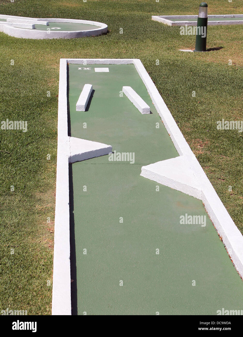 Hole on crazy golf course outdoors. Stock Photo