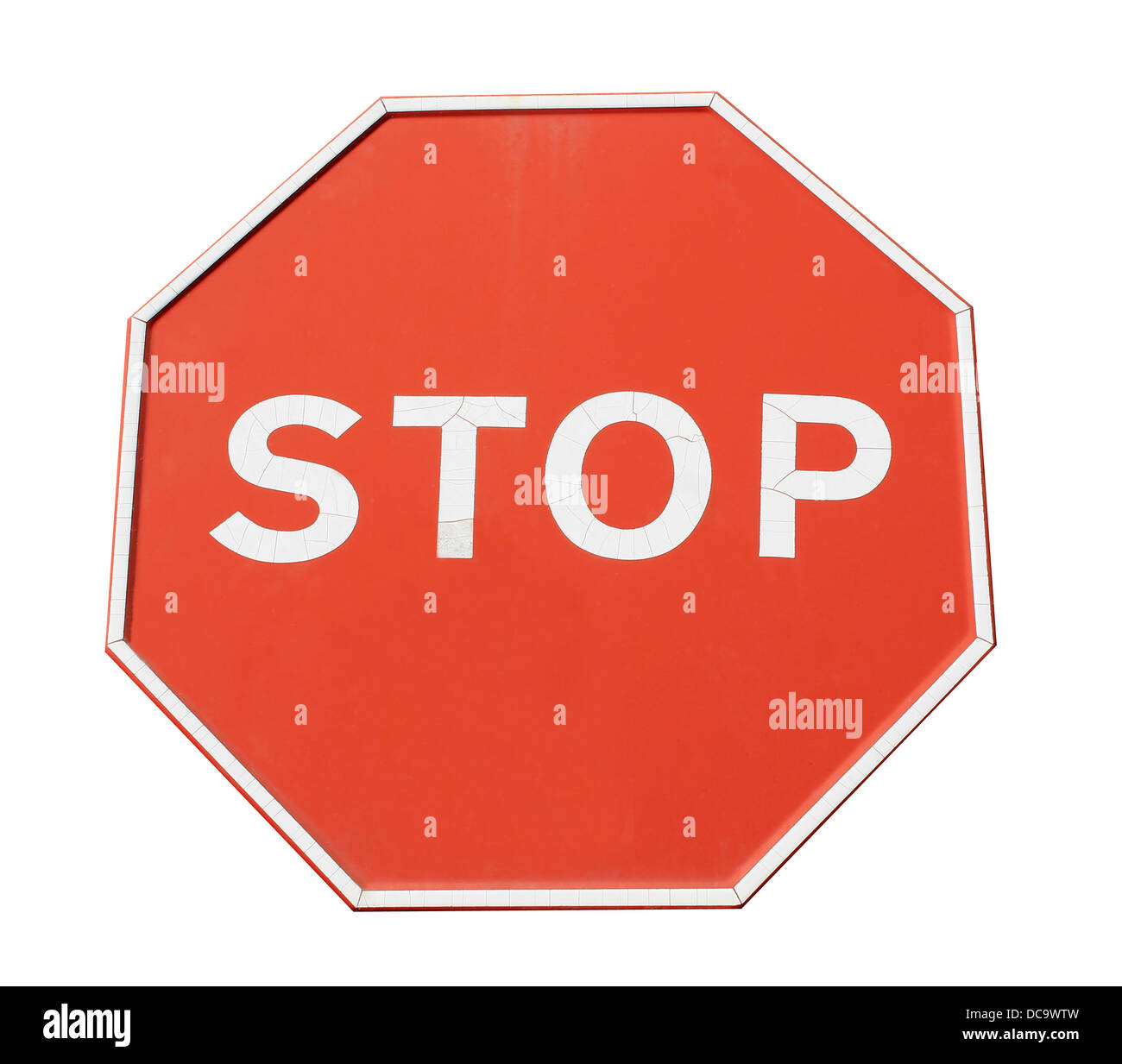 Red hexagonal stop sign isolated on white background. Stock Photo