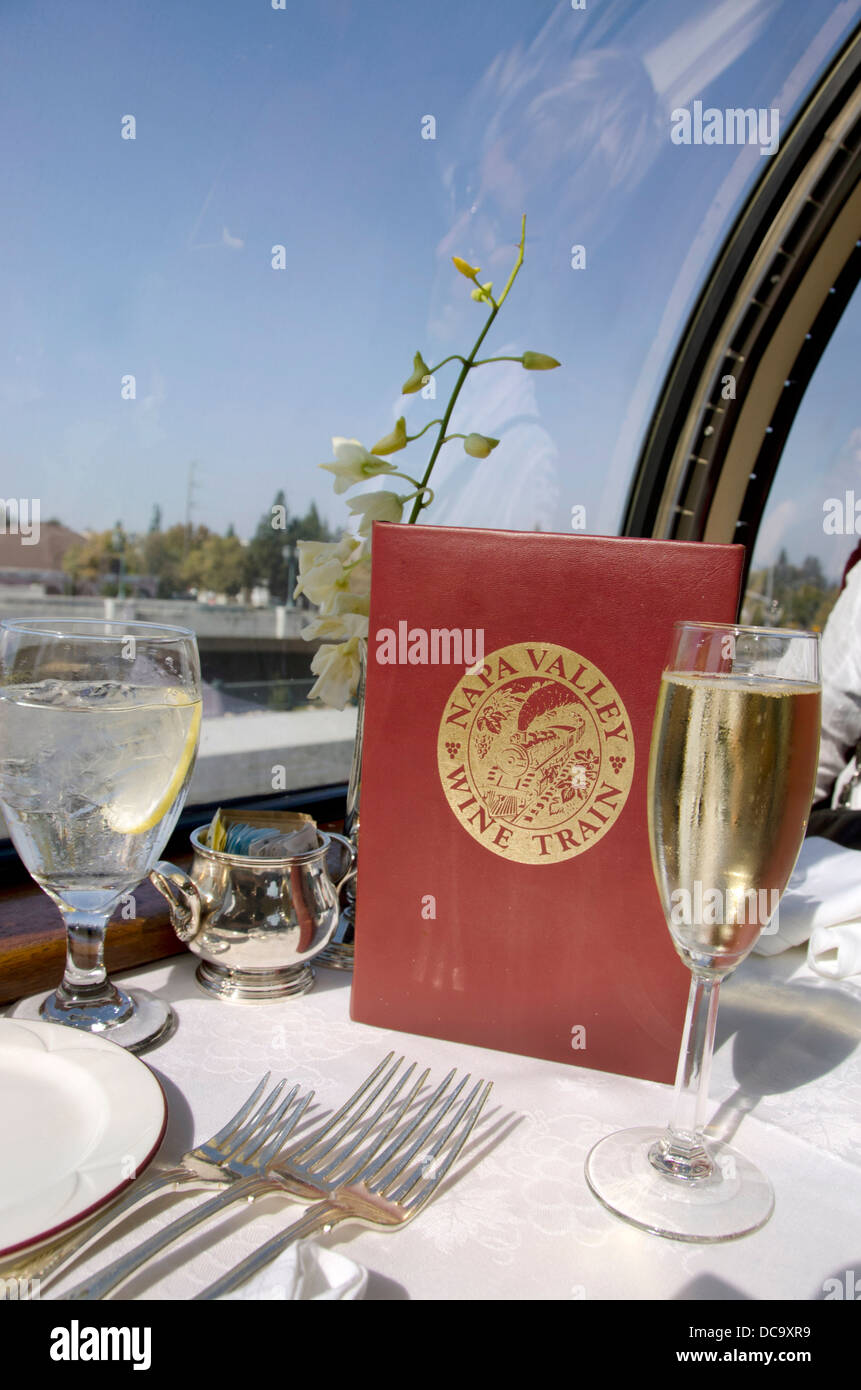 USA, California, Sonoma, Napa Valley Wine Train. Wine Train menu and glass of sparkling wine in the Vista Dome car. Stock Photo