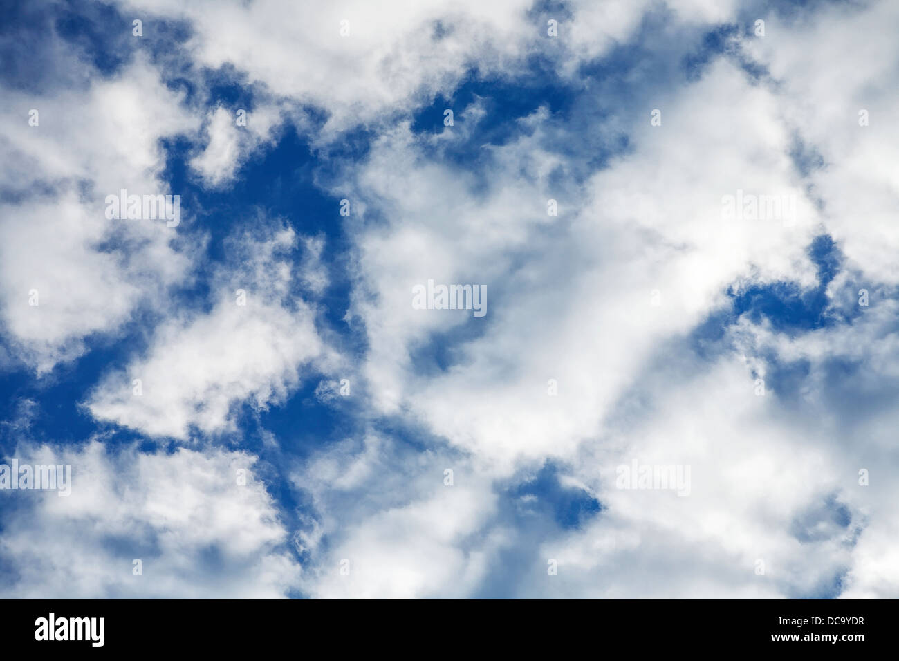 Blue sky and white fluffy clouds Stock Photo