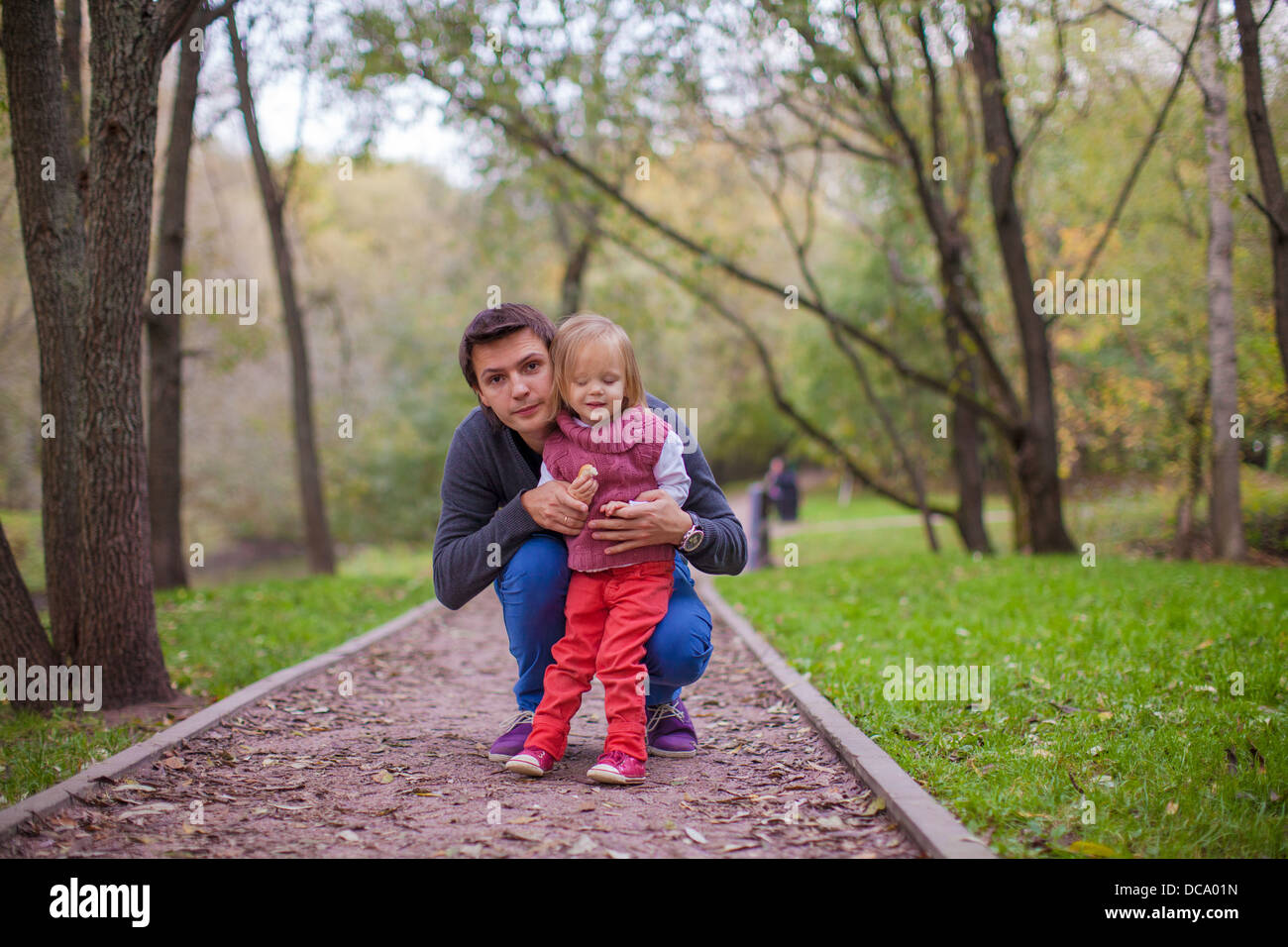 Young father with his cute little daughter in autumn park Stock Photo ...