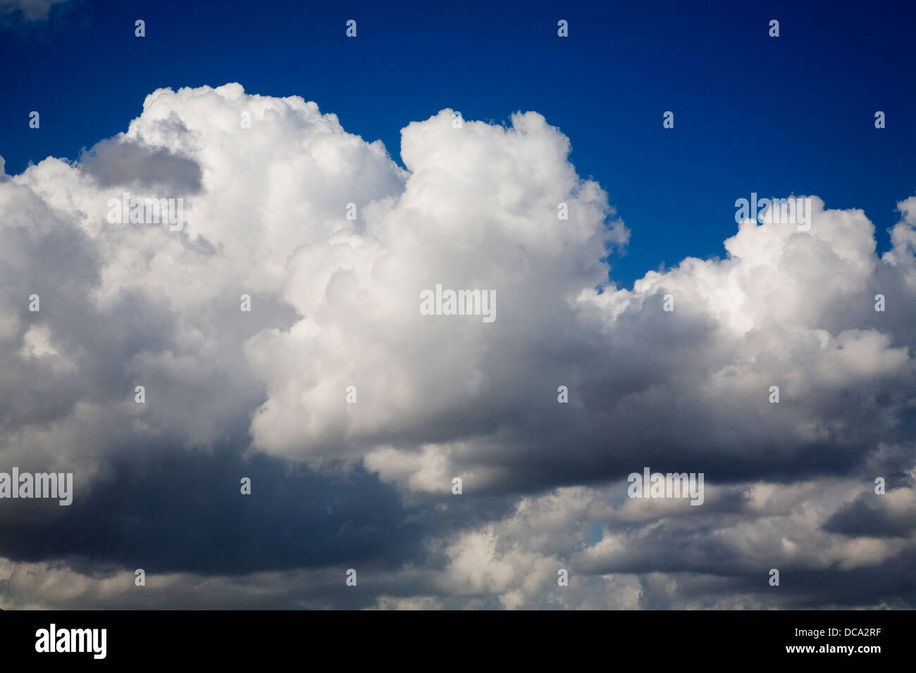 White fluffy cumulus clouds blue sky Stock Photo