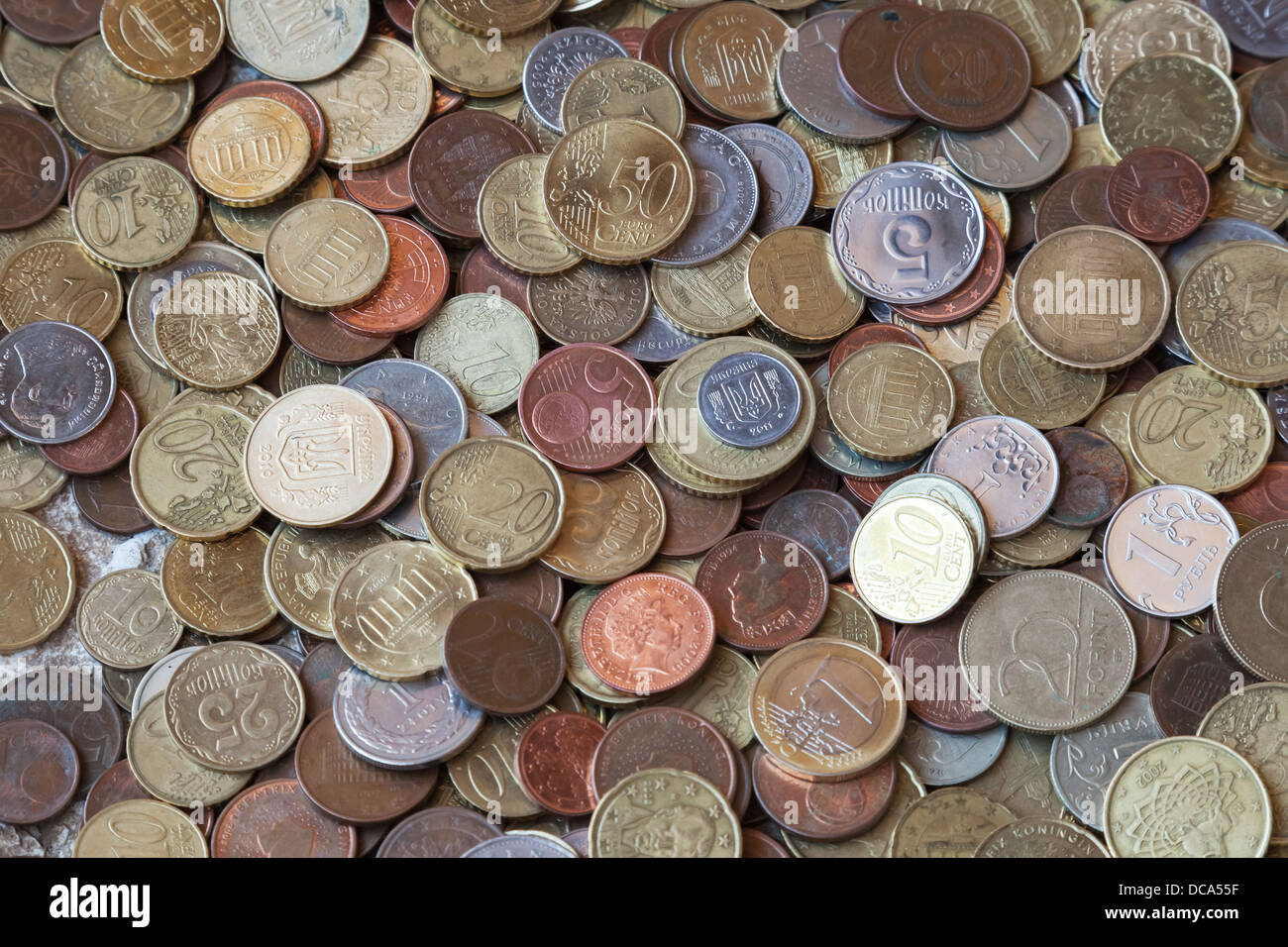 Photo background texture with small coins of different European countries Stock Photo