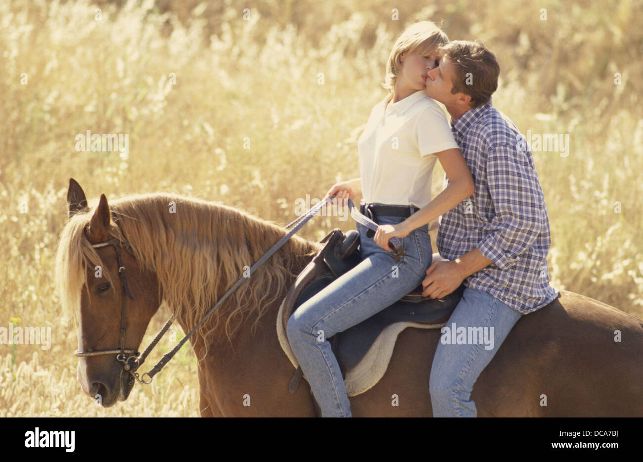 Couple horse riding romantic hi-res stock photography and images - Alamy