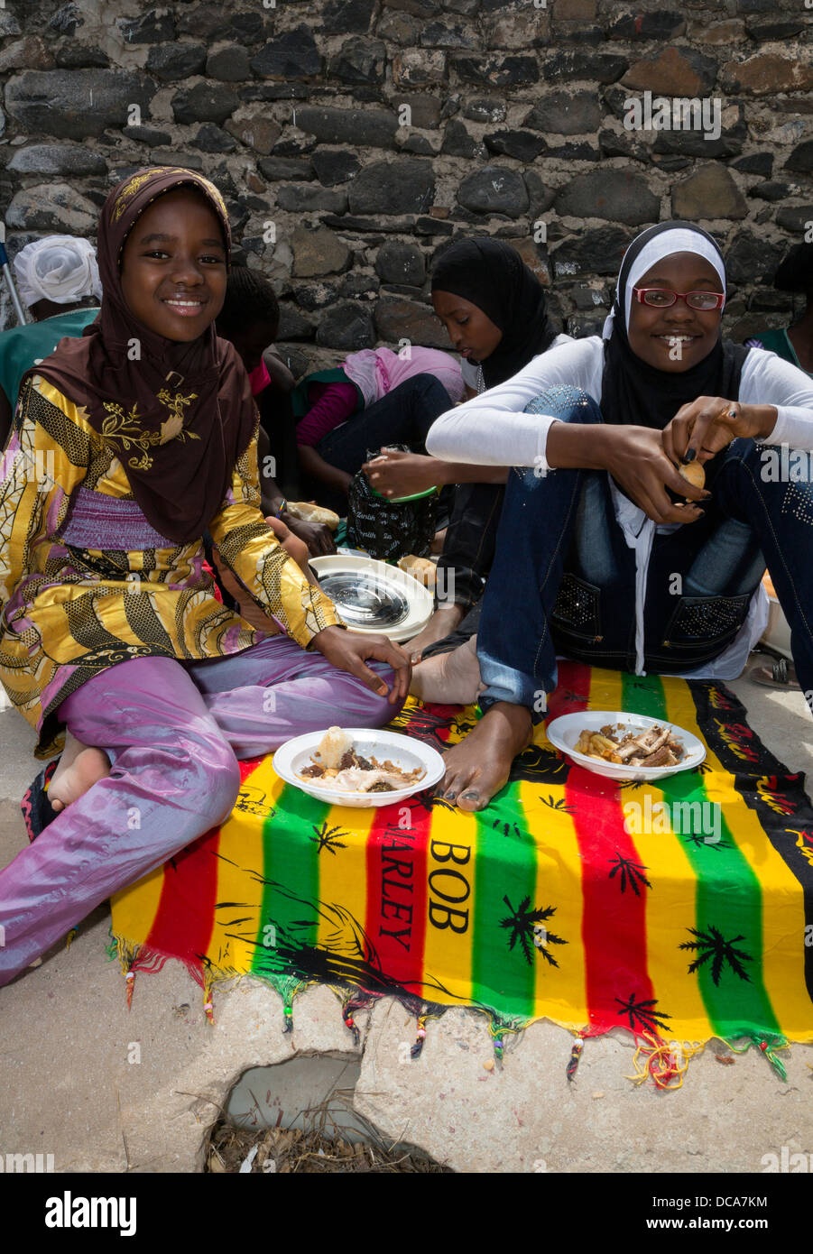 Muslim Senegalese Schoolgirls Visiting Goree for the Day, Goree Island, Senegal. Lunch time. Stock Photo