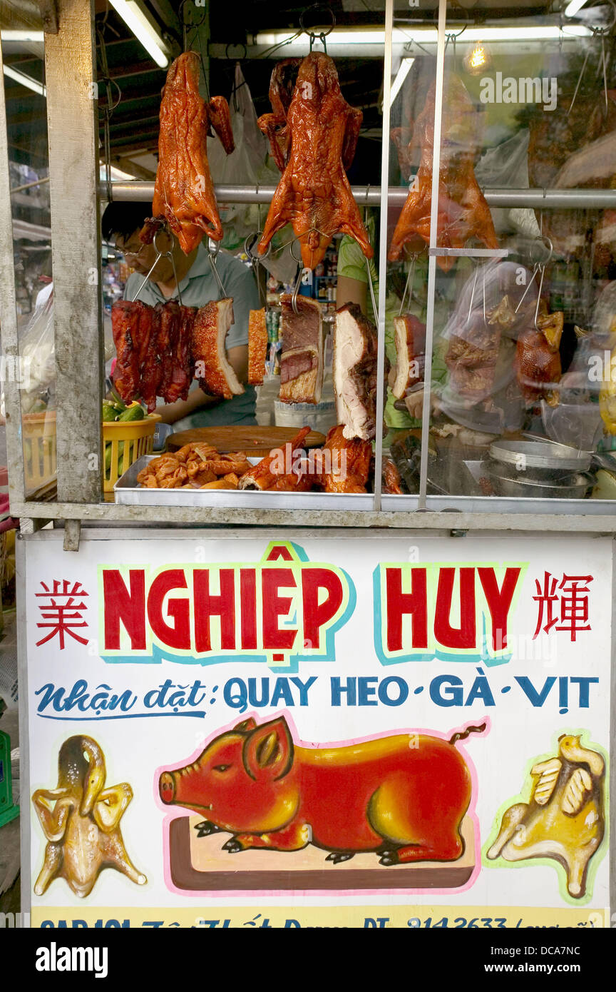Food stall with pork. Motorcycle parking. Ho Chi Minh City. Vietnam