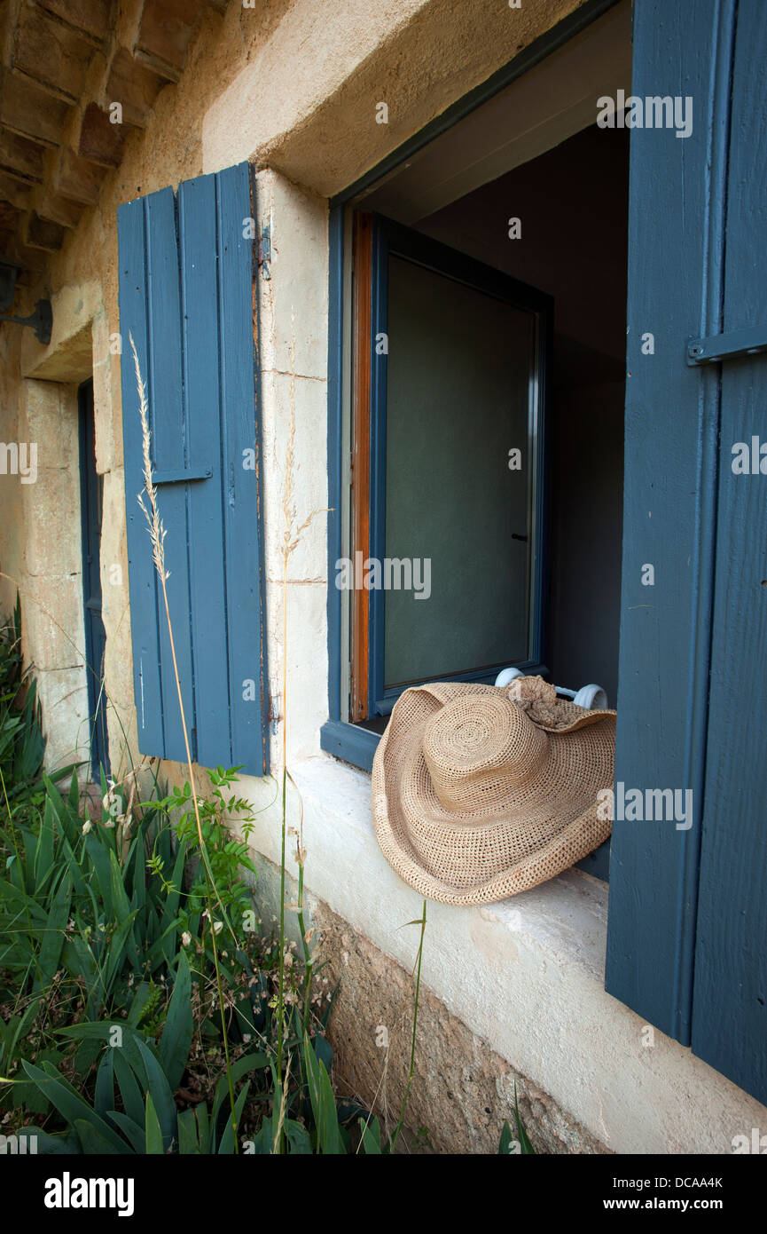 Hat in window at Fajac-La-Selve at Pech-Luna in Languedoc-Roussillon, Southwest France. July 2013 Stock Photo