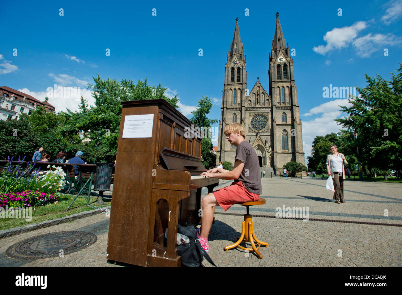 Prague, Czech Republic. 13th August 2013. People play public accessed piano at Prague's Namesti Miru Square, Czech Republic as coffee owner Ondrej Kobza placed pianos on several places in Prague where people can play these music instruments freely. Kobza wants to make the public area more cosy. (CTK Photo/Vit Simanek/Alamy Live News) Stock Photo