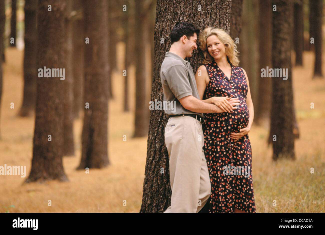 Man and pregnant woman Stock Photo - Alamy