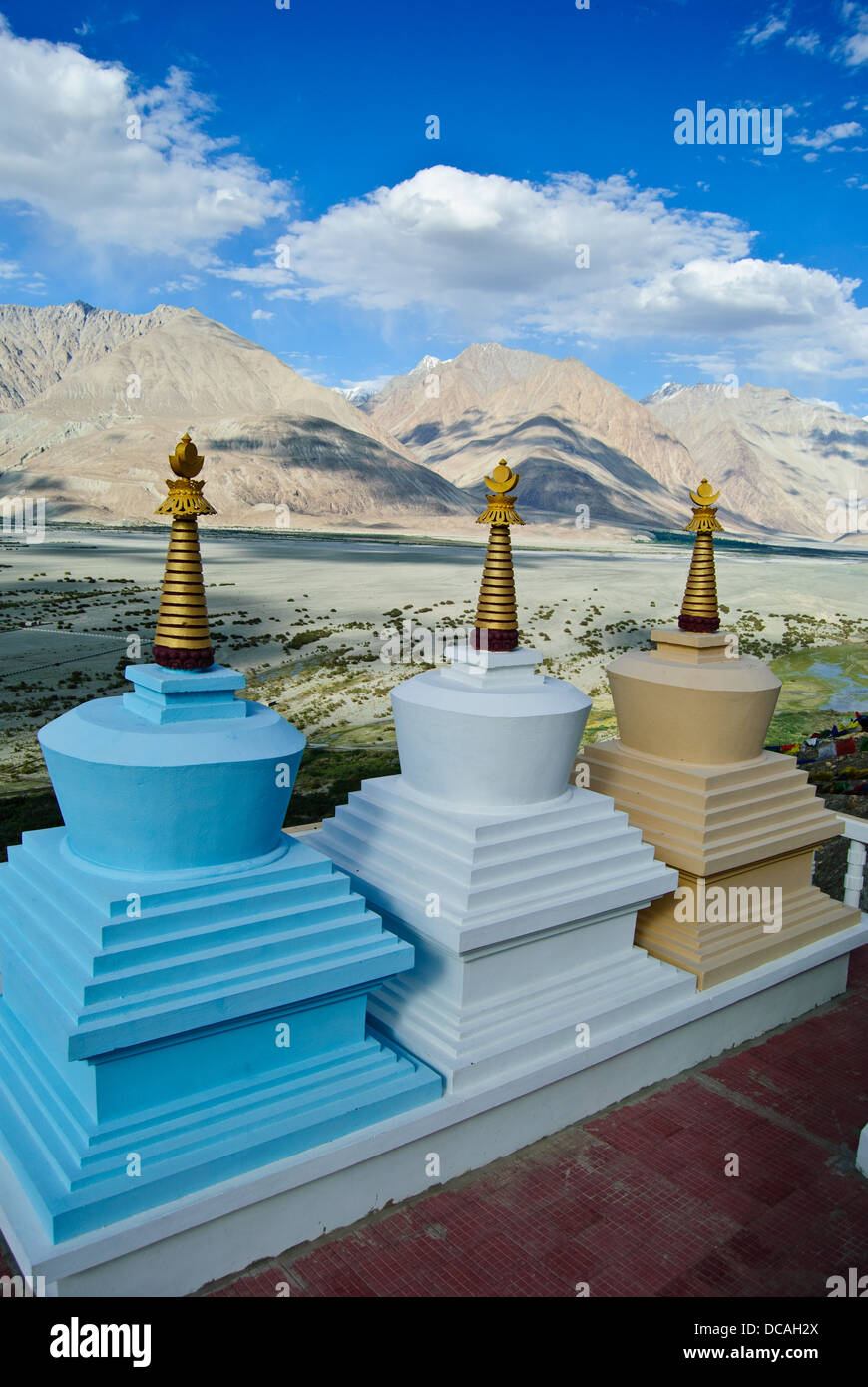 Three small pagodas and the Nubra Valley Stock Photo