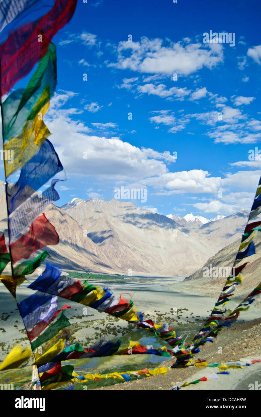 Prayer flags waving above the highland of Nubra Valley Stock Photo