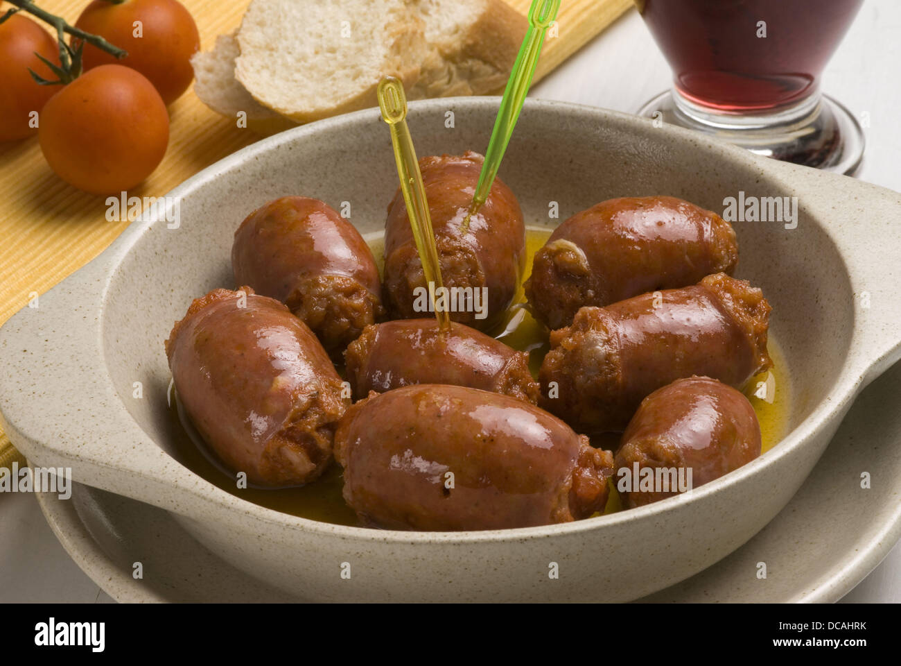 Sausages with red wine sauce Stock Photo Alamy