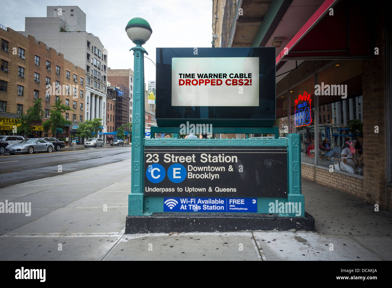 An electronic billboard on a subway entrance in New York urges