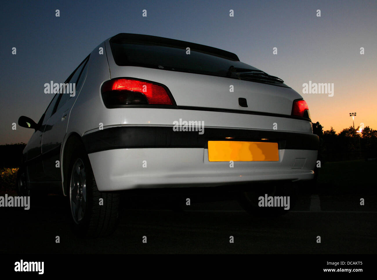 White Hatchback in sunset Stock Photo Alamy