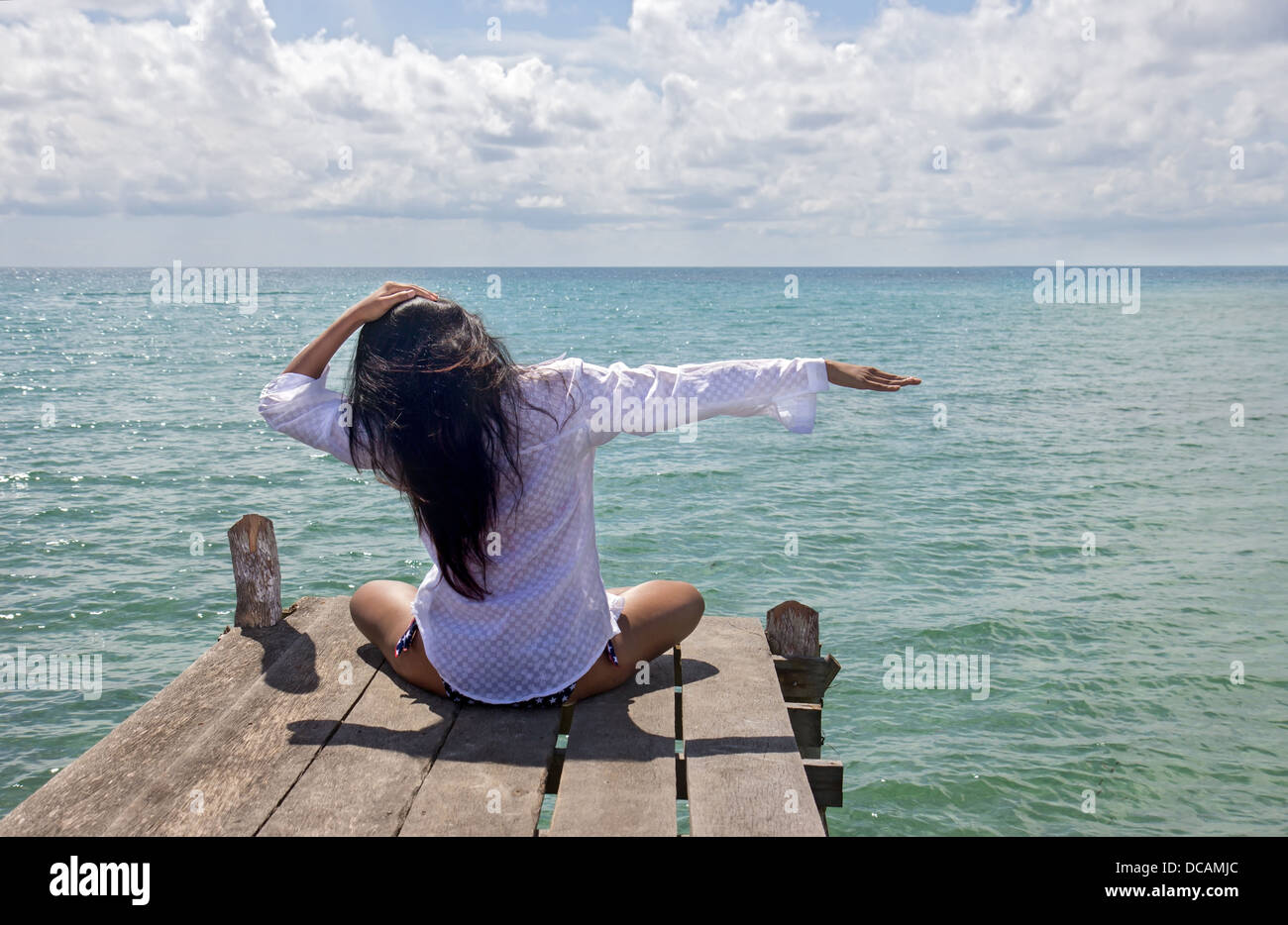 woman meditating on the sea Stock Photo - Alamy