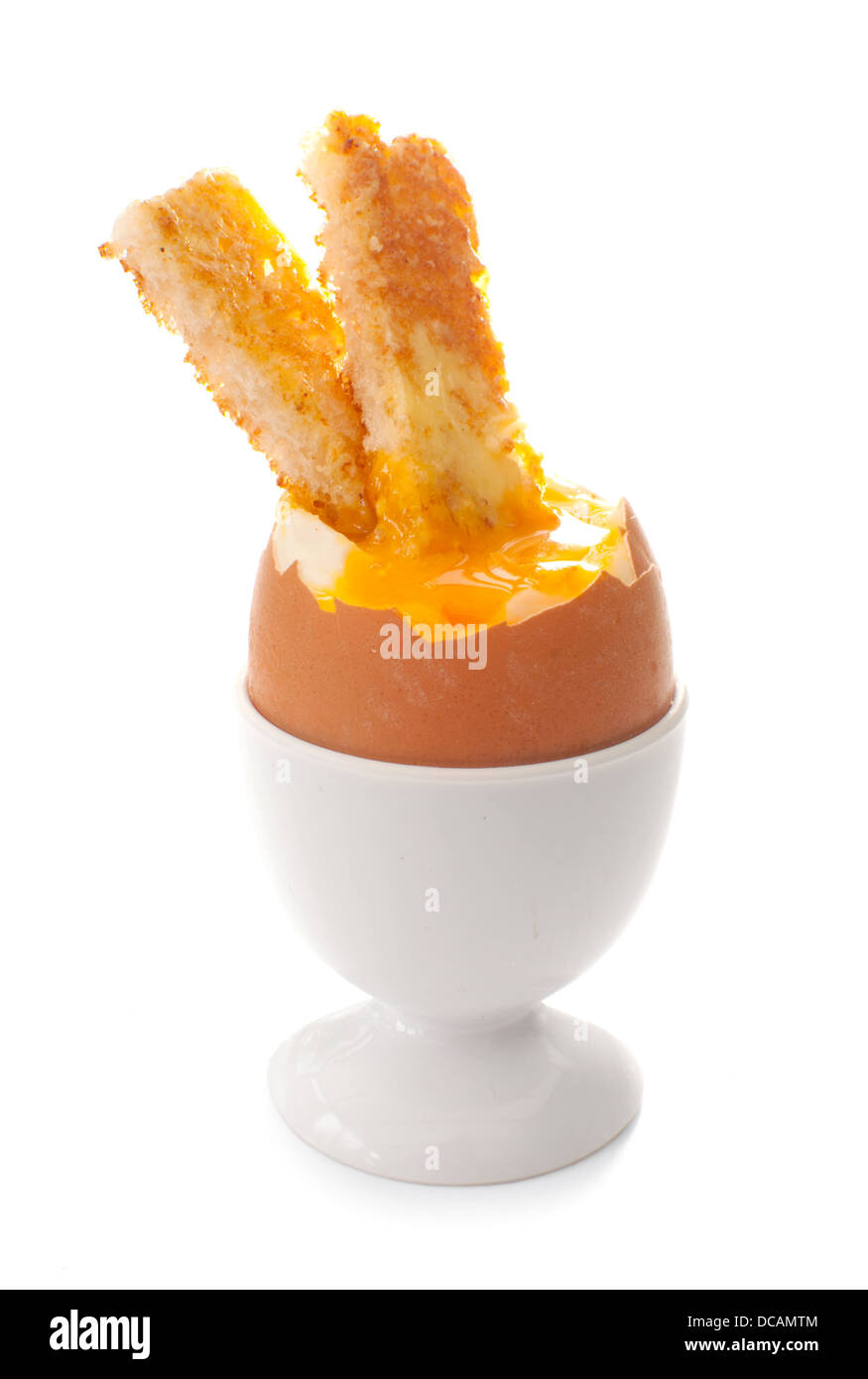 Toast stick dipped in boiled egg Stock Photo Alamy